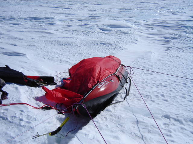 Close call. The crevase almost took the sled and the man. 