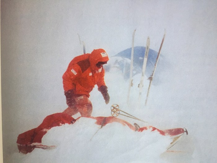 Blizzard and out checking the sled and tent.